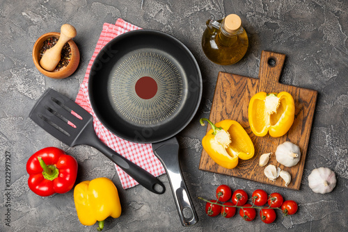 Frying pan. Empty non-stick frying pan and kitchen utensils set on textured wooden background. cooking concept. Top view. Space for text. Flat lay. Recipe. photo