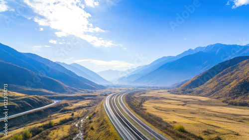 scenic highway winding through valley with mountains