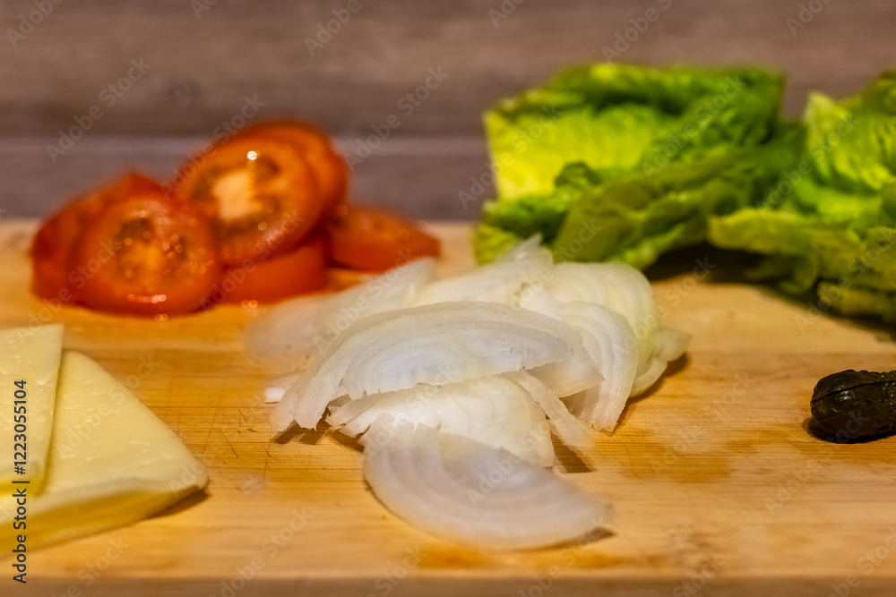 Fresh ingredients ready for preparation on a wooden cutting board in a cozy kitchen environment during evening time Fresh ingredients ready for preparation on a wooden cutting board in a cozy kitchen environment during evening time