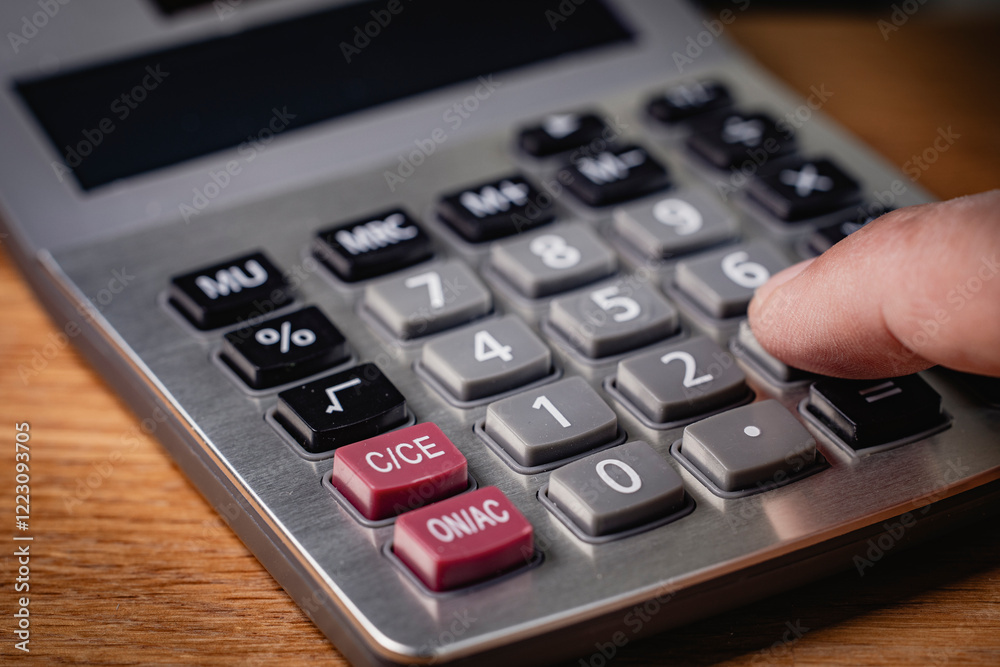 Calculator on wooden table background, business and finance concept. Calculator on wooden table background, business and finance concept.