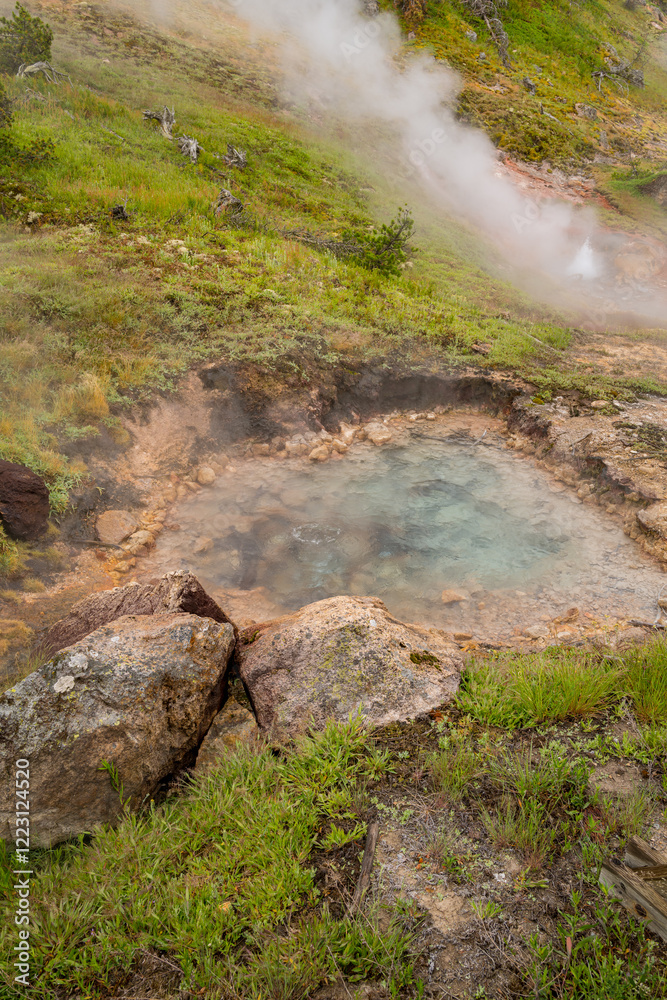 Geothermal coloroful turquoise pool and rising steam in Yellowstone Geothermal coloroful turquoise pool and rising steam in Yellowstone