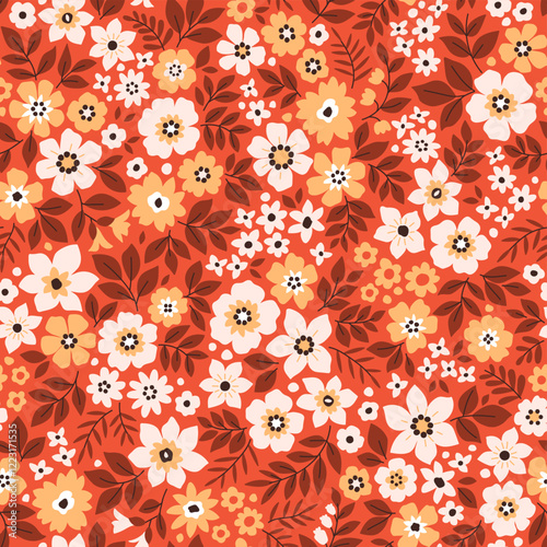 Retro floral pattern in small decorative flowers. Small white and yellow flowers. Orange terracotta background. Ditsy print. Floral seamless background ditsy pattern in small cute abstract flowers.