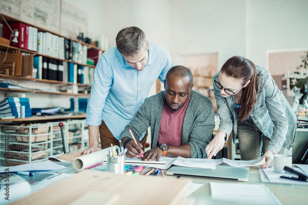 Obraz premium Diverse architects working together on project in modern office