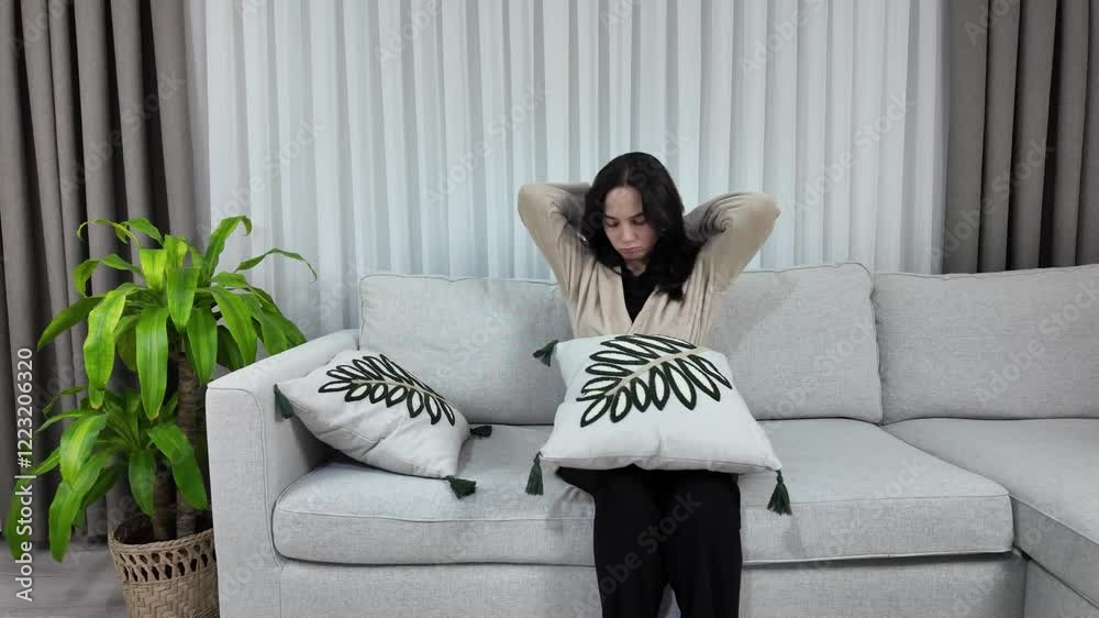 young alone woman is sadly lying down on a couch on a valentines day in depression mode. young alone woman is sadly lying down on a couch on a valentines day in depression mode.