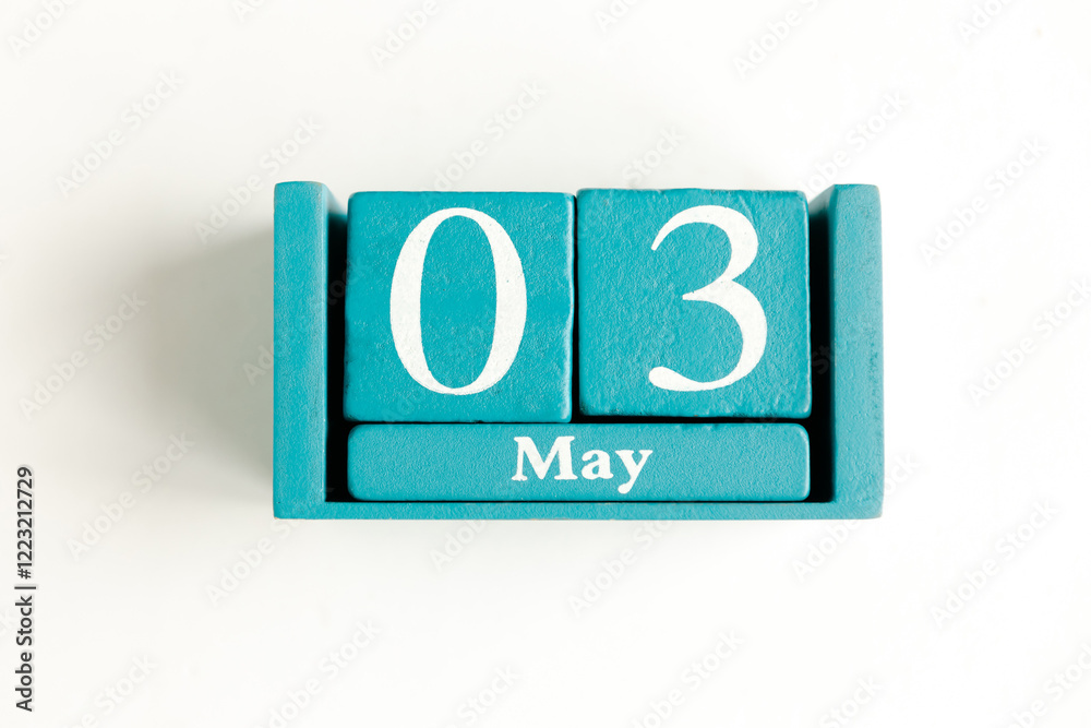 May 3. Blue cube calendar with month date isolated on white background. May 3. Blue cube calendar with month date isolated on white background.