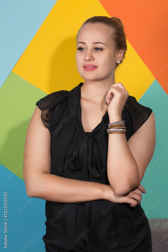 Pensive woman in black dress and bracelet.