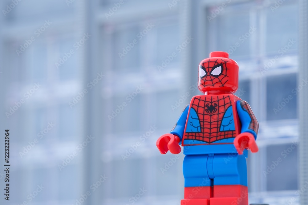 Obraz premium Tambov, Russian Federation - January 24, 2025 Lego Spiderman minifigure standing in front of an office building