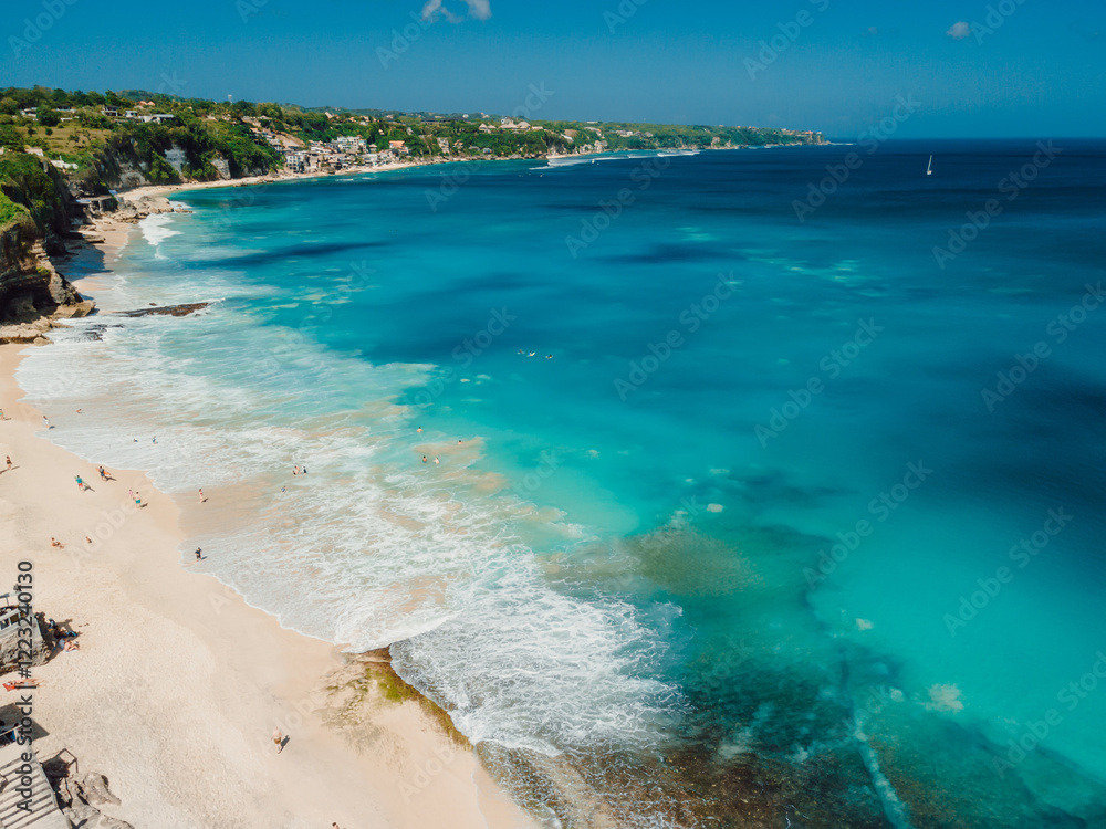 Tropical landscape with blue ocean. Holiday sandy beach in Bali. Dreamland beach Tropical landscape with blue ocean. Holiday sandy beach in Bali. Dreamland beach