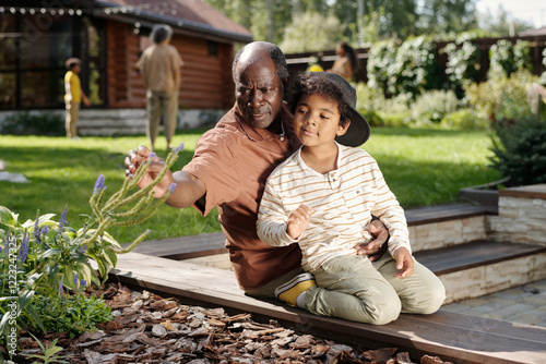 Enjoying Outdoor Gardening with Grandfather photo