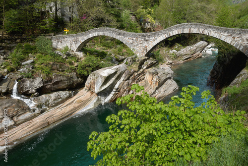 famous Ponte dei Salti Bridge in Val Verzasca at Verzasca River,Lavertezzo,Ticino canton,Switzerland photo