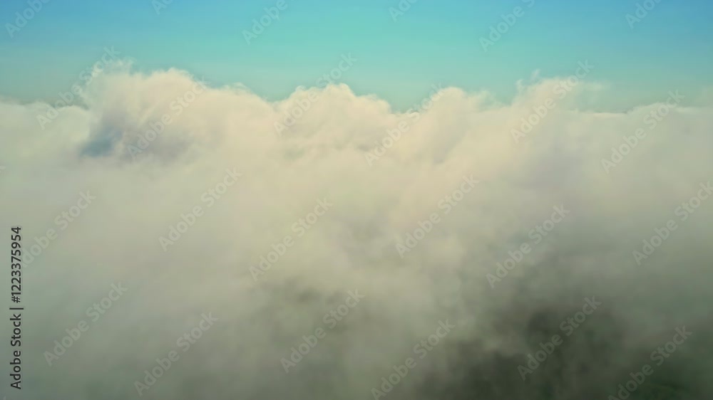 Establishing drone shot of sea of fog with clouds in the day Establishing drone shot of sea of fog with clouds in the day