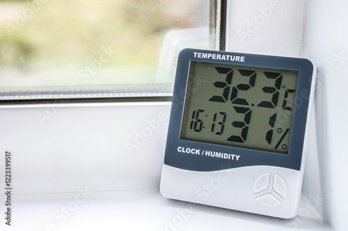 Fototapeta Naklejka Na Ścianę i Meble -  Temperature Humidity Clock Digital Thermometer Indoor Weather Monitoring Device