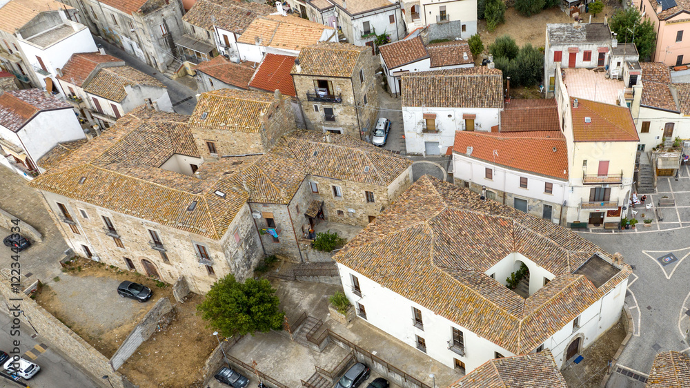 Aerial view of houses and apartments in the historic center of a small village. The town is Nova Siri located on a hill in Basilicata, Italy. Aerial view of houses and apartments in the historic center of a small village. The town is Nova Siri located on a hill in Basilicata, Italy.