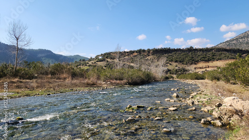 Fototapeta Naklejka Na Ścianę i Meble -  Eglence river crossing the Çukur village in Karaisali district of Adana province in Türkiye 