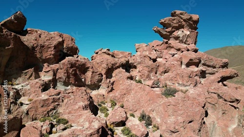 Drone shot of wind sculpted Red Sandstone Rocks in the geological formation Italia Perdida in Bolivia, Nor Lípez province of the Potosi department near Mallcu Villamar.