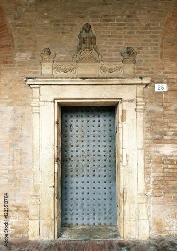 Old wooden door in the historic center of Bologna, Italy photo