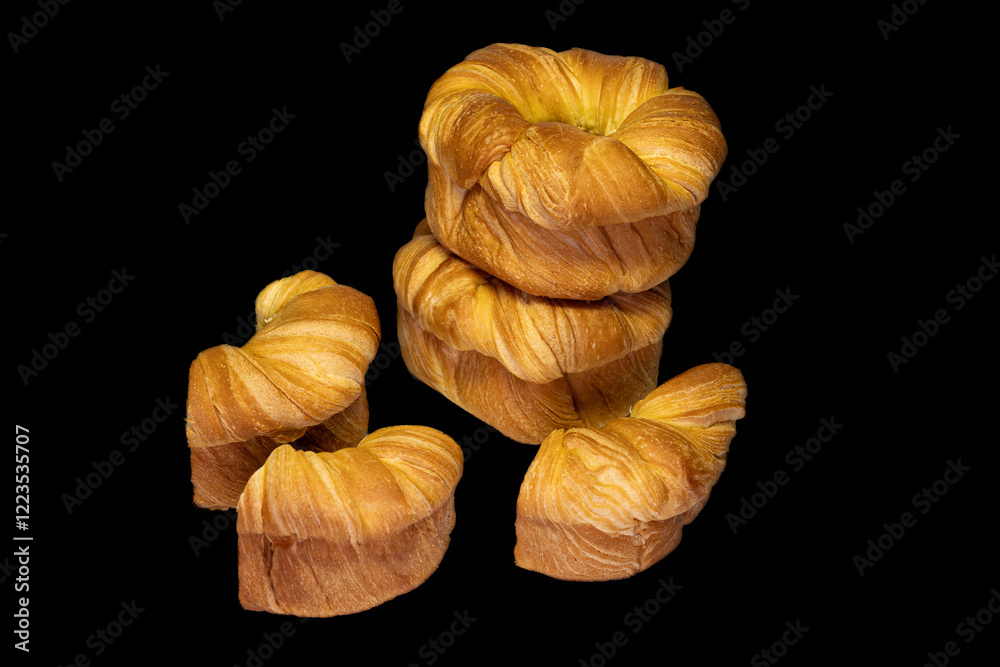 Generated golden color sweet butter bread on a black background. Generated golden color sweet butter bread on a black background.