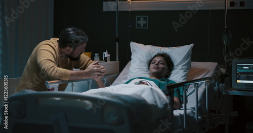 Foto Young girl lies unconscious in a hospital bed with an oxygen tube in her nose