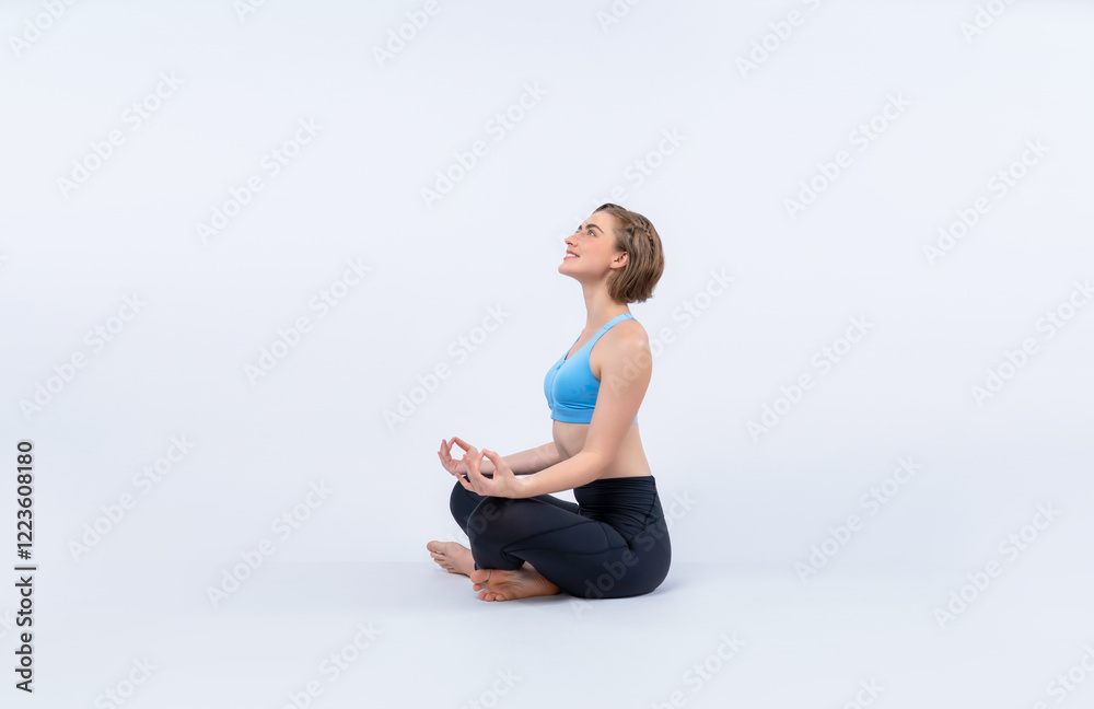 Fototapeta premium Full body length gaiety shot athletic and sporty woman doing healthy and meditative yoga exercise workout posture on isolated background. Healthy active and body care lifestyle