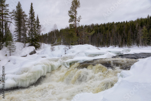 Winter landscape with a waterfall and snow. Russia, Karelia photo