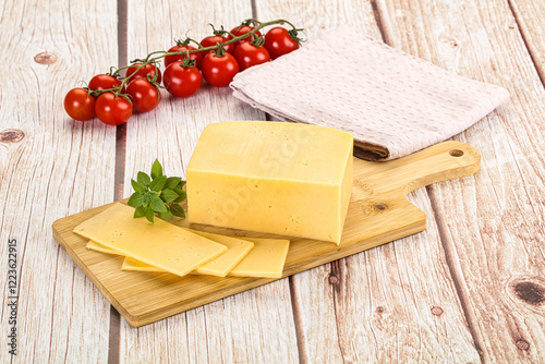 Yellow cheese piece with slices photo