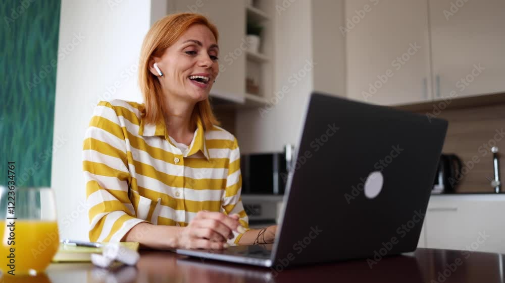 Businesswoman making a video call on her laptop Businesswoman making a video call on her laptop