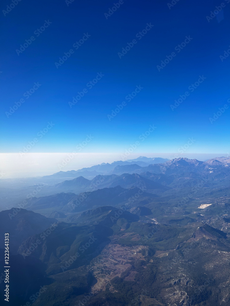 Breathtaking view from airplane on mountain landscape Breathtaking view from airplane on mountain landscape