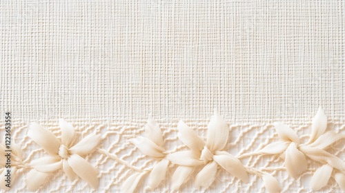 Cream background with delicate floral ornament of handmade ribbons. Handmade concept, embroidery photo