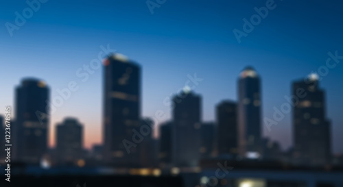 Blurred Cityscape at Dusk: Modern Skyscrapers at Sunset