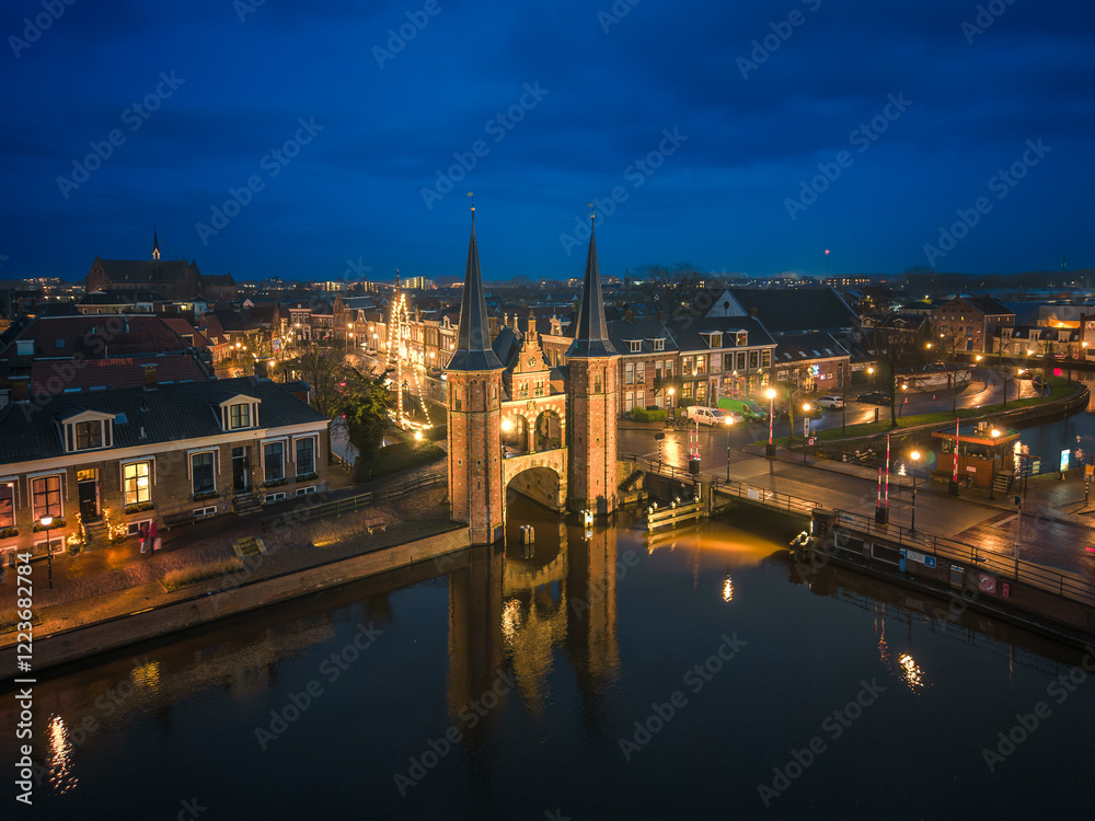 Fototapeta premium Night aerial of historic Frisian city Sneek with iconic Watergate