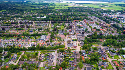 A wide aerial panorama shot around the old town of the city Burgum on a sunny summer day in the Netherlands  photo