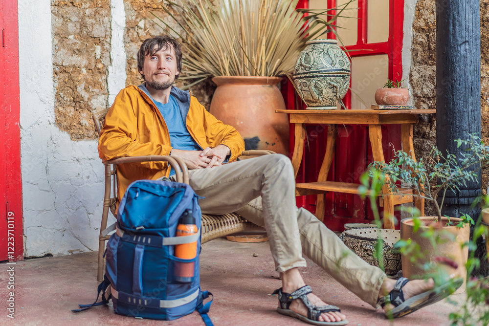 Male tourist in a colonial house in San Cristobal de las Casas, Mexico. Cultural exploration, architecture, and travel experience concept