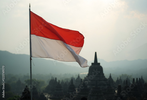 Indonesian Flag Waving over Borobudur Temple at Sunrise