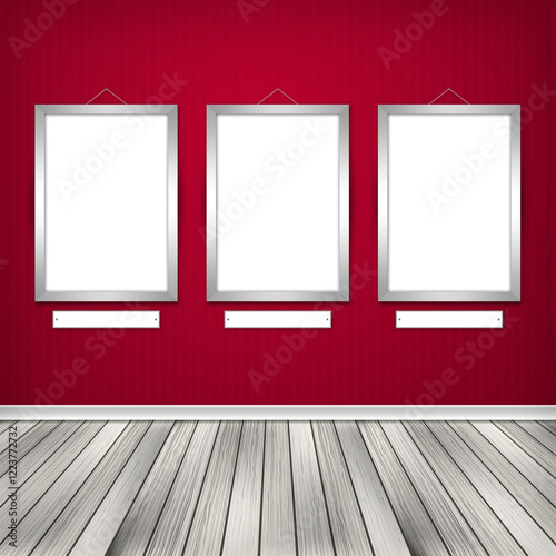 Gallery interior with three empty frames on wall.