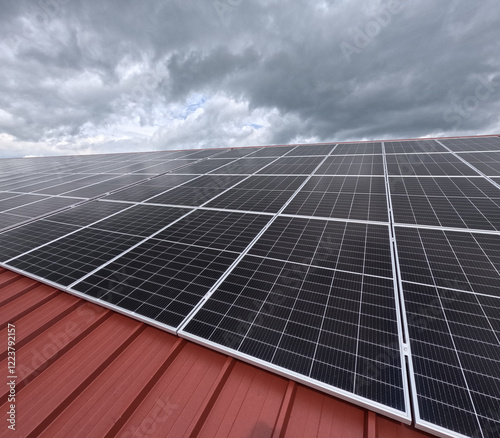 Extensive Solar Panel Array on the Metal Roof of a Large Industrial Facility