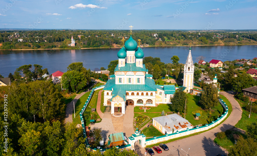 Obraz premium Top view of the Resurrection Cathedral and residential buildings, as well as the Volga River in the town of Tutaev, Russia