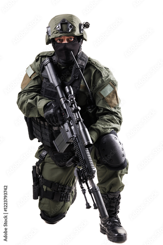 Special forces member in tactical gear and rifle, kneeling action position Special forces member in tactical gear and rifle, kneeling action position