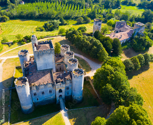Aerial view of impressive medieval castle of Chateau de Roquetaillade in green valley in Mazeres near Bordeaux, France