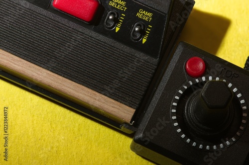 Close up of vintage game console with joystick photo