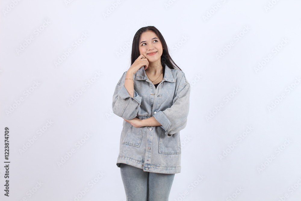 Woman Thinks and Dreams While Posing Thoughtfully with Hand on Chin, Looking Upward Woman Thinks and Dreams While Posing Thoughtfully with Hand on Chin, Looking Upward