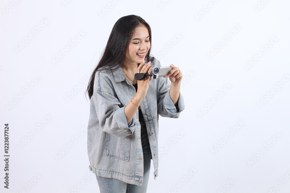 Woman Records Video with Camcorder Smoothly and Precisely on White Background Woman Records Video with Camcorder Smoothly and Precisely on White Background