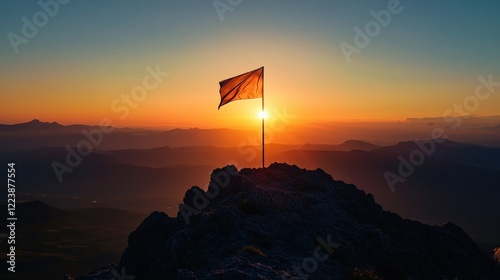 Flag waving at sunrise on mountain peak nature photography serene landscape inspirational viewpoint photo