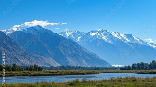 Obraz na płótnie A breathtaking view of towering snow-capped mountains under a clear blue sky w salonie