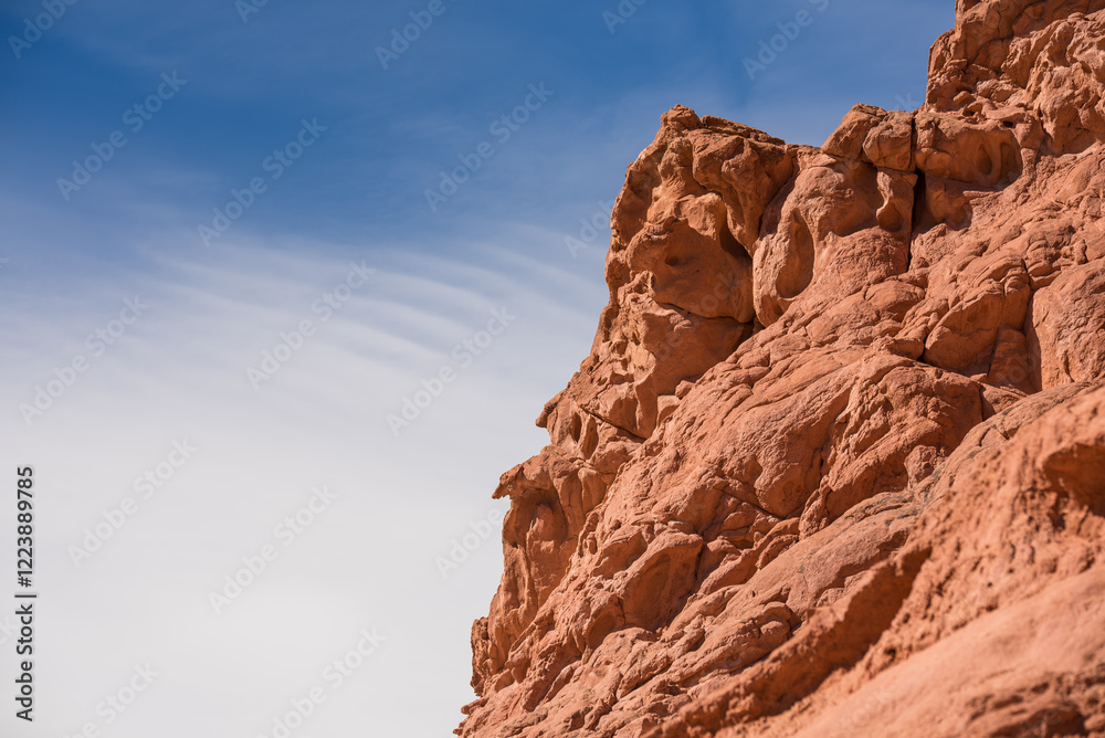 Fototapeta premium Rocky desert formations colorful red mountain with a blue sky 