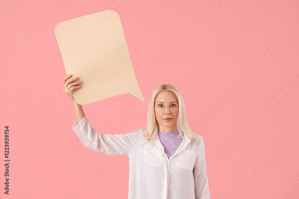 Mature woman with blank speech bubble on pink background Mature woman with blank speech bubble on pink background