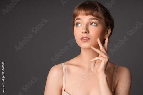 Beautiful young woman on da...