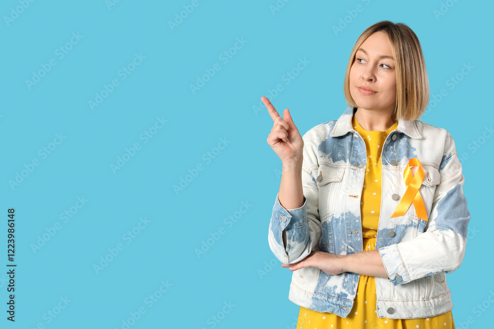 Beautiful mature woman with ribbon pointing at something on blue background. Multiple Sclerosis Awareness Month Beautiful mature woman with ribbon pointing at something on blue background. Multiple Sclerosis Awareness Month