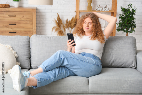 Young woman using mobile ph...