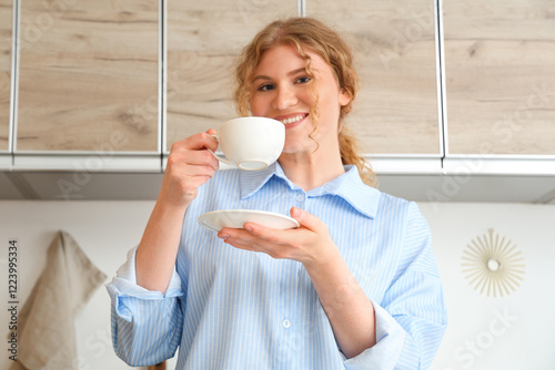 Young woman with coffee cup...