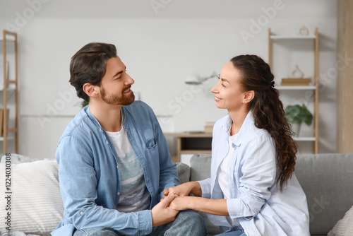 Married couple holding hand...